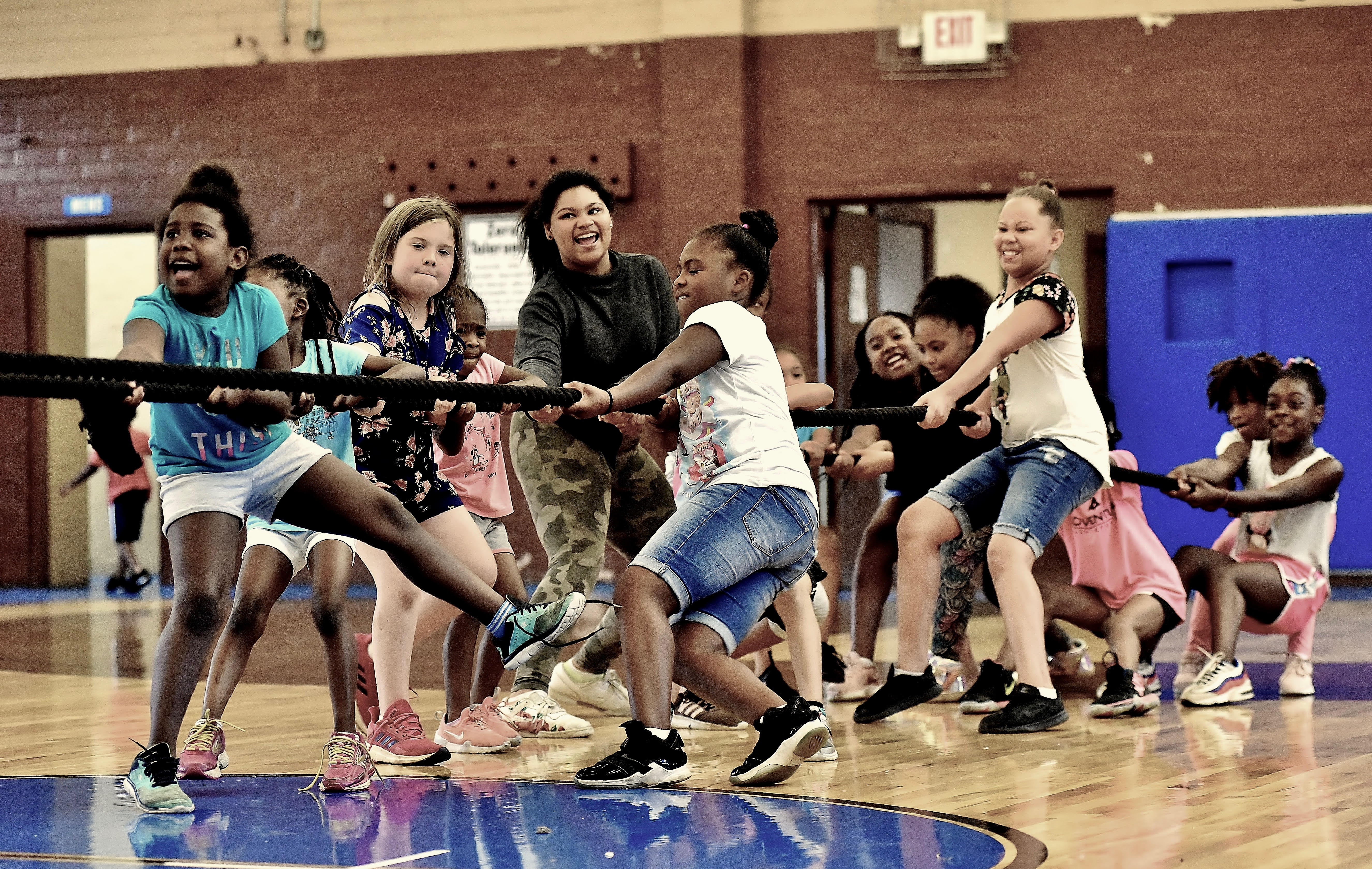 ELW campers in a tug-of-war activity in the gym